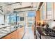 Bright kitchen with modern island, granite countertops, and stainless-steel appliances at 2100 16Th St # 408, Denver, CO 80202