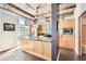 Bright kitchen with modern island, granite countertops, and stainless-steel appliances at 2100 16Th St # 408, Denver, CO 80202