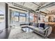 Open concept living room featuring modern design and large windows at 2100 16Th St # 408, Denver, CO 80202