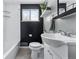 Modern bathroom with stylish fixtures, a subway tile backsplash, and a window for natural light at 7135 W 24Th Ave, Lakewood, CO 80214