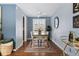 Bright dining room with hardwood floors, modern furnishings, and a ceiling fan at 7135 W 24Th Ave, Lakewood, CO 80214