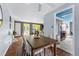 Open dining room featuring hardwood floors, modern furniture, and a view of the Gathering room at 7135 W 24Th Ave, Lakewood, CO 80214