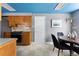 Kitchen featuring a stainless steel refrigerator and range oven with wood cabinets and tiled backsplash at 7135 W 24Th Ave, Lakewood, CO 80214