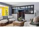 Elegant living room featuring hardwood floors, stylish furniture, and a partial view of the cozy fireplace at 7135 W 24Th Ave, Lakewood, CO 80214