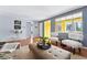 Bright living room with hardwood floors, modern furnishings, and colorful accent walls at 7135 W 24Th Ave, Lakewood, CO 80214