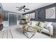 Spacious living room featuring modern decor, a ceiling fan, and an adjacent Gathering room at 7135 W 24Th Ave, Lakewood, CO 80214