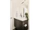 Bathroom features a vanity, large mirror, modern fixtures, and a towel rack at 1168 S Reed Way, Lakewood, CO 80232