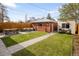 Landscaped backyard with a patio area, perfect for entertaining and relaxing at 3085 W 36Th Ave, Denver, CO 80211
