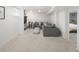 Relaxing basement living area boasts cozy seating, a large sectional, and bright recessed lighting at 3085 W 36Th Ave, Denver, CO 80211