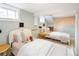 Bright bedroom featuring two cozy beds, playful decor, and soft, inviting lighting at 3085 W 36Th Ave, Denver, CO 80211