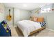 A cozy bedroom decorated with a guitar, colorful bunting, and inviting decor at 3085 W 36Th Ave, Denver, CO 80211