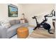 Bright bonus room featuring a comfortable seating area and modern exercise equipment at 3085 W 36Th Ave, Denver, CO 80211