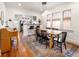 Bright dining area featuring a large wooden table and an eat-in bar at 3085 W 36Th Ave, Denver, CO 80211