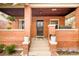 Charming covered front porch with brick pillars and vintage details at 3085 W 36Th Ave, Denver, CO 80211