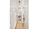 Bright hallway with hardwood floors and pendant lighting, creating a welcoming transition between rooms in the home at 3085 W 36Th Ave, Denver, CO 80211
