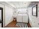 Functional laundry room features a washer, dryer, utility sink, and ample storage space at 3085 W 36Th Ave, Denver, CO 80211