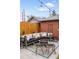 Cozy patio featuring a comfortable cushioned seating area with throw pillows and a fire pit at 3085 W 36Th Ave, Denver, CO 80211