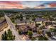 Breathtaking aerial view showcasing the building, surrounding landscape and distant mountains at 5873 S Prince St # 209B, Littleton, CO 80120