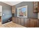 Charming dining area with built-in cabinets, a window view, and hardwood flooring at 5429 S Waco St, Centennial, CO 80015