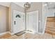 Welcoming foyer with a decorative front door, wood flooring, and a coat closet at 5429 S Waco St, Centennial, CO 80015
