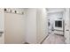 Well-lit laundry room featuring modern washer and dryer units and gray wood-look flooring at 5429 S Waco St, Centennial, CO 80015