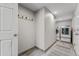 The laundry room boasts a washer, dryer, charming decor, a door to the side, and a neutral color palette at 5429 S Waco St, Centennial, CO 80015