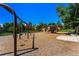Community playground featuring swings, a slide, and climbing areas at 5429 S Waco St, Centennial, CO 80015