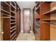 Spacious walk-in closet with custom shelving, drawers, and ample storage space for clothes and accessories at 5429 S Waco St, Centennial, CO 80015