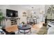 Open concept living and dining area with hardwood floors and a modern aesthetic at 1811 S Quebec Way # 134, Denver, CO 80231