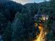 Aerial view of a secluded home tucked away in a dense forest at 9506 S Deer Creek Canyon Rd, Littleton, CO 80127