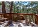 Secluded deck overlooking the forest, offering a private and tranquil setting for enjoying the outdoors at 9506 S Deer Creek Canyon Rd, Littleton, CO 80127