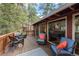 Inviting outdoor deck with comfortable seating, offering a perfect spot for relaxation and enjoying the views at 9506 S Deer Creek Canyon Rd, Littleton, CO 80127