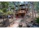 Beautiful two-story home featuring a spacious deck and outdoor living area at 9506 S Deer Creek Canyon Rd, Littleton, CO 80127