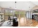 Bright office space with hardwood floors, floor-to-ceiling windows, and outdoor views at 9506 S Deer Creek Canyon Rd, Littleton, CO 80127