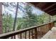 Scenic view from the deck showcasing the surrounding lush greenery and natural beauty of the landscape at 9506 S Deer Creek Canyon Rd, Littleton, CO 80127