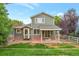 Expansive backyard featuring a well-maintained lawn and charming patio area at 13612 Plaster Cir, Broomfield, CO 80023