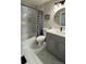 Chic bathroom with marble-look tile and a modern vanity at 13612 Plaster Cir, Broomfield, CO 80023