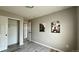 Grey floored bedroom featuring closet and artwork at 13612 Plaster Cir, Broomfield, CO 80023