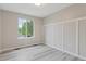 A well-lit bedroom featuring light grey flooring and nice trim at 13612 Plaster Cir, Broomfield, CO 80023