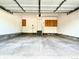 Spacious two-car garage with built-in storage cabinets and access door at 13612 Plaster Cir, Broomfield, CO 80023