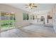Open living room with a view of the kitchen and a sliding door leading to the backyard at 13612 Plaster Cir, Broomfield, CO 80023