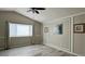 A well lit main bedroom featuring wall trim, neutral paint, and large window at 13612 Plaster Cir, Broomfield, CO 80023
