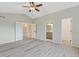 A spacious main bedroom with vaulted ceiling, fan, and doors leading to bathroom and closet at 13612 Plaster Cir, Broomfield, CO 80023