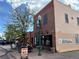 A bakery with outdoor seating featuring a brick exterior and an inviting 