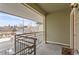 Private balcony with metal railing, providing a cozy outdoor space with neighborhood views at 5420 Allison St # 202, Arvada, CO 80002