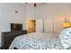 Comfortable bedroom features neutral walls, a ceiling fan, a chest of drawers, a closet, and natural light at 5420 Allison St # 202, Arvada, CO 80002