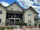 Modern townhome exterior with multiple balconies, creating a welcoming and stylish facade at 5420 Allison St # 202, Arvada, CO 80002