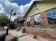 Community clubhouse with stylish brick architecture and outdoor seating, perfect for gatherings at 5420 Allison St # 202, Arvada, CO 80002