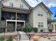 Inviting townhome complex with landscaped front, accessible stairways, and private balconies at 5420 Allison St # 202, Arvada, CO 80002