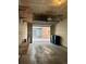 Garage with an open door, plenty of storage space, and convenient access to the exterior at 5420 Allison St # 202, Arvada, CO 80002